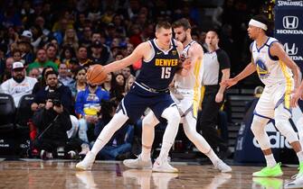 DENVER, CO - MARCH 3: Nikola Jokic #15 of the Denver Nuggets handles the ball during a game against the Golden State Warriors on March 3, 2020 at the Pepsi Center in Denver, Colorado. NOTE TO USER: User expressly acknowledges and agrees that, by downloading and/or using this Photograph, user is consenting to the terms and conditions of the Getty Images License Agreement. Mandatory Copyright Notice: Copyright 2020 NBAE (Photo by Bart Young/NBAE via Getty Images)