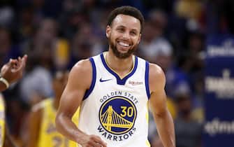 SAN FRANCISCO, CALIFORNIA - OCTOBER 18:  Stephen Curry #30 of the Golden State Warriors laughs after he is fouled by Kostas Antetokounmpo #37 of the Los Angeles Lakers at Chase Center on October 18, 2019 in San Francisco, California. NOTE TO USER: User expressly acknowledges and agrees that, by downloading and or using this photograph, User is consenting to the terms and conditions of the Getty Images License Agreement. (Photo by Ezra Shaw/Getty Images)