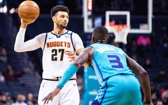 1210666349 CHARLOTTE, NORTH CAROLINA - MARCH 05: Jamal Murray #27 of the Denver Nuggets is defended by Terry Rozier #3 of the Charlotte Hornets during the first quarter during their game at Spectrum Center on March 05, 2020 in Charlotte, North Carolina. NOTE TO USER: User expressly acknowledges and agrees that, by downloading and/or using this photograph, user is consenting to the terms and conditions of the Getty Images License Agreement. (Photo by Jacob Kupferman/Getty Images)