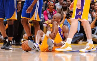 LOS ANGELES, CA - APRIL 12: Kobe Bryant #24 of the Los Angeles Lakers reacts on the floor after getting injured during a game against the Golden State Warriors at Staples Center on April 12, 2013 in Los Angeles, California. NOTE TO USER: User expressly acknowledges and agrees that, by downloading and/or using this Photograph, user is consenting to the terms and conditions of the Getty Images License Agreement. Mandatory Copyright Notice: Copyright 2013 NBAE (Photo by Andrew D. Bernstein/NBAE via Getty Images)