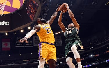 LOS ANGELES, CA - MARCH 6: Giannis Antetokounmpo #34 of the Milwaukee Bucks shoots the ball while LeBron James #23 of the Los Angeles Lakers plays defense during the game on March 6, 2020 at STAPLES Center in Los Angeles, California. NOTE TO USER: User expressly acknowledges and agrees that, by downloading and/or using this Photograph, user is consenting to the terms and conditions of the Getty Images License Agreement. Mandatory Copyright Notice: Copyright 2020 NBAE (Photo by Andrew D. Bernstein/NBAE via Getty Images)