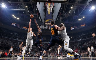 1205709804 CLEVELAND, OH - MARCH 7: Nikola Jokic #15 of the Denver Nuggets shoots the ball against the Cleveland Cavaliers on March 7, 2020 at Rocket Mortgage FieldHouse in Cleveland, Ohio. NOTE TO USER: User expressly acknowledges and agrees that, by downloading and/or using this Photograph, user is consenting to the terms and conditions of the Getty Images License Agreement. Mandatory Copyright Notice: Copyright 2020 NBAE (Photo by David Liam Kyle/NBAE via Getty Images)