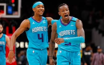 ATLANTA, GA - MARCH 09: Terry Rozier #3  reacts with Devonte' Graham #4 of the Charlotte Hornets after landing a three pointer in the second overtime of an NBA game against the Atlanta Hawks at State Farm Arena on March 9, 2020 in Atlanta, Georgia. NOTE TO USER: User expressly acknowledges and agrees that, by downloading and/or using this photograph, user is consenting to the terms and conditions of the Getty Images License Agreement. (Photo by Todd Kirkland/Getty Images) *** Local Caption *** Terry Rozier; Devonte' Graham