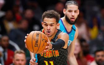 ATLANTA, GA - MARCH 09: Trae Young #11 of the Atlanta Hawks battles for control of the ball during the second half of an NBA game against the Charlotte Hornets at State Farm Arena on March 9, 2020 in Atlanta, Georgia. NOTE TO USER: User expressly acknowledges and agrees that, by downloading and/or using this photograph, user is consenting to the terms and conditions of the Getty Images License Agreement. (Photo by Todd Kirkland/Getty Images) *** Local Caption *** Trae Young