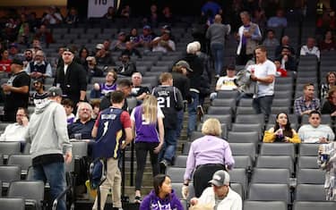 SACRAMENTO, CALIFORNIA - MARCH 11:   Fans leave the building after the Sacramento King game against the New Orleans Pelicans was postponed due to the corona virus at Golden 1 Center on March 11, 2020 in Sacramento, California. NOTE TO USER: User expressly acknowledges and agrees that, by downloading and or using this photograph, User is consenting to the terms and conditions of the Getty Images License Agreement.  (Photo by Ezra Shaw/Getty Images)