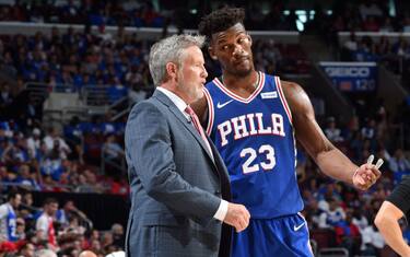 PHILADELPHIA, PA - APRIL 13: Head Coach Brett Brown and Jimmy Butler #23 of the Philadelphia 76ers talk during a game against the Brooklyn Nets during Game One of Round One of the 2019 NBA Playoffs on April 13, 2019 at the Wells Fargo Center in Philadelphia, Pennsylvania NOTE TO USER: User expressly acknowledges and agrees that, by downloading and/or using this Photograph, user is consenting to the terms and conditions of the Getty Images License Agreement. Mandatory Copyright Notice: Copyright 2019 NBAE (Photo by Jesse D. Garrabrant/NBAE via Getty Images)