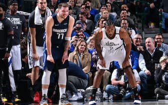DALLAS, TX - JANUARY 21: Luka Doncic #77 of the Dallas Mavericks and Kawhi Leonard #2 of the LA Clippers look on during the game on January 21, 2020 at the American Airlines Center in Dallas, Texas. NOTE TO USER: User expressly acknowledges and agrees that, by downloading and or using this photograph, User is consenting to the terms and conditions of the Getty Images License Agreement. Mandatory Copyright Notice: Copyright 2020 NBAE (Photo by Glenn James/NBAE via Getty Images)