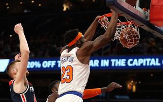 WASHINGTON, DC - MARCH 10: Mitchell Robinson #23 of the New York Knicks dunks against the Washington Wizards during the first half at Capital One Arena on March 10, 2020 in Washington, DC. NOTE TO USER: User expressly acknowledges and agrees that, by downloading and or using this photograph, User is consenting to the terms and conditions of the Getty Images License Agreement. (Photo by Patrick Smith/Getty Images)