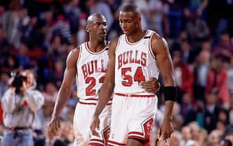 CHICAGO - MAY 19:  Michael Jordan #23 comforts teammate Horace Grant #54 of the Chicago Bulls during Game One of the Eastern Conference Finals against the Cleveland Cavaliers played on May 19, 1992 at Chicago Stadium in Chicago, Illinois.  NOTE TO USER: User expressly acknowledges and agrees that, by downloading and/or using this Photograph, user is consenting to the terms and conditions of the Getty Images License Agreement.  Mandatory Copyright Notice:  Copyright 1992 NBAE  (Photo by Nathaniel S. Butler/NBAE via Getty Images)