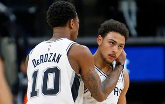 1076964816 SAN ANTONIO, TX - JANUARY 3: DeMar DeRozan #10 of the San Antonio Spurs congratulates teammate Bryn Forbes #11after a three against the Toronto Raptors at AT&T Center on January 3, 2019 in San Antonio, Texas. NOTE TO USER: User expressly acknowledges and agrees that , by downloading and or using this photograph, User is consenting to the terms and conditions of the Getty Images License Agreement. (Photo by Ronald Cortes/Getty Images)