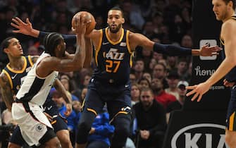 LOS ANGELES, CA - DECEMBER 28:     Jordan Clarkson #00 and Rudy Gobert #27 of the Utah Jazz defend Kawhi Leonard #2 of the Los Angeles Clippers in the second half of the game at Staples Center on December 28, 2019 in Los Angeles, California. NOTE TO USER: User expressly acknowledges and agrees that, by downloading and/or using this Photograph, user is consenting to the terms and conditions of the Getty Images License Agreement. (Photo by Jayne Kamin-Oncea/Getty Images)