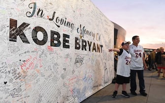 LOS ANGELES, CA - JANUARY 31: Fans honor Kobe Bryant outside of the Staples Center before the game between the Portland Trail Blazers and the Los Angeles Lakers on January 31, 2020 at STAPLES Center in Los Angeles, California. NOTE TO USER: User expressly acknowledges and agrees that, by downloading and/or using this Photograph, user is consenting to the terms and conditions of the Getty Images License Agreement. Mandatory Copyright Notice: Copyright 2020 NBAE (Photo by Juan Ocampo/NBAE via Getty Images)