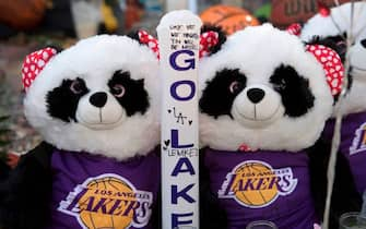 Panda Bear Lakers fans at a Staples Center memorial to NBA legend Kobe Bryant, who was killed last weekend in a helicopter accident, in Los Angeles, California on January 31, 2020. (Photo by Mark RALSTON / AFP) (Photo by MARK RALSTON/AFP via Getty Images)