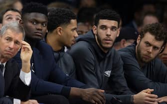 PHILADELPHIA, PA - DECEMBER 13: Zion Williamson #1, Josh Hart #3, and Lonzo Ball #2 of the New Orleans Pelicans look on from the bench against the Philadelphia 76ers at the Wells Fargo Center on December 13, 2019 in Philadelphia, Pennsylvania. The 76ers defeated the Pelicans 116-109. NOTE TO USER: User expressly acknowledges and agrees that, by downloading and/or using this photograph, user is consenting to the terms and conditions of the Getty Images License Agreement. (Photo by Mitchell Leff/Getty Images) *** Local Caption *** Zion Williamson;Josh Hart;Lonzo Ball