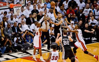 MIAMI, FL - JUNE 6: Tony Parker #9 of the San Antonio Spurs shoots a floater against Ray Allen #34 of the Miami Heat during Game One of the 2013 NBA Finals on June 6, 2013 at American Airlines Arena in Miami, Florida. NOTE TO USER: User expressly acknowledges and agrees that, by downloading and or using this photograph, User is consenting to the terms and conditions of the Getty Images License Agreement. Mandatory Copyright Notice: Copyright 2013 NBAE (Photo by Noah Graham/NBAE via Getty Images)