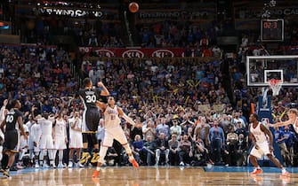 OKLAHOMA CITY, OK - FEBRUARY 27:  Stephen Curry #30 of the Golden State Warriors hits the winning shot against Andre Roberson #21 of the Oklahoma City Thunder on February 27, 2016 at Chesapeake Energy Arena in Oklahoma City, Oklahoma. NOTE TO USER: User expressly acknowledges and agrees that, by downloading and or using this photograph, User is consenting to the terms and conditions of the Getty Images License Agreement. Mandatory Copyright Notice: Copyright 2016 NBAE (Photo by Joe Murphy/NBAE via Getty Images)