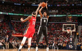 1195365781 NEW ORLEANS, LA - JANUARY 22: Dejounte Murray #5 of the San Antonio Spurs shoots three point basket against the New Orleans Pelicans on January 22, 2020 at the Smoothie King Center in New Orleans, Louisiana. NOTE TO USER: User expressly acknowledges and agrees that, by downloading and or using this Photograph, user is consenting to the terms and conditions of the Getty Images License Agreement. Mandatory Copyright Notice: Copyright 2020 NBAE (Photo by Layne Murdoch Jr./NBAE via Getty Images)