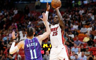 1211892492 MIAMI, FLORIDA - MARCH 11: Kendrick Nunn #25 of the Miami Heat shoots over Cody Martin #11 of the Charlotte Hornets during the second half at American Airlines Arena on March 11, 2020 in Miami, Florida. NOTE TO USER: User expressly acknowledges and agrees that, by downloading and/or using this photograph, user is consenting to the terms and conditions of the Getty Images License Agreement. (Photo by Michael Reaves/Getty Images)