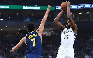 MILWAUKEE, WISCONSIN - MARCH 04: Khris Middleton #22 of the Milwaukee Bucks shoots over Malcolm Brogdon #7 of the Indiana Pacers during the first half of a game at Fiserv Forum on March 04, 2020 in Milwaukee, Wisconsin. NOTE TO USER: User expressly acknowledges and agrees that, by downloading and or using this photograph, User is consenting to the terms and conditions of the Getty Images License Agreement. (Photo by Stacy Revere/Getty Images)