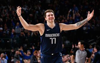 DALLAS, TX - DECEMBER 4: Luka Doncic #77 of the Dallas Mavericks smiles during the game against the Minnesota Timberwolves on December 04, 2019 at the American Airlines Center in Dallas, Texas. NOTE TO USER: User expressly acknowledges and agrees that, by downloading and or using this photograph, User is consenting to the terms and conditions of the Getty Images License Agreement. Mandatory Copyright Notice: Copyright 2019 NBAE (Photo by Glenn James/NBAE via Getty Images)