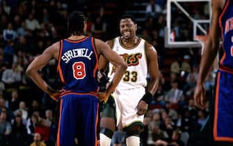 SEATTLE - 2001: Patrick Ewing #33 of the Seattle SuperSonics talks with Latrell Sprewell #8 of the New York Knicks during an NBA game at the Key Arena in Seattle, Washington.    NOTE TO USER: User expressly acknowledges  and agrees that, by downloading and or using this  photograph, User is consenting to the terms and conditions of the Getty Images License Agreement. (Photo by Jeff Reinking/ NBAE/ Getty Images)