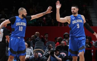 WASHINGTON, DC -  JANUARY 1: Evan Fournier #10 of the Orlando Magic and Nikola Vucevic #9 of the Orlando Magic high-fives during a game against the Washington Wizards on January 1, 2020 at Capital One Arena in Washington, DC. NOTE TO USER: User expressly acknowledges and agrees that, by downloading and or using this Photograph, user is consenting to the terms and conditions of the Getty Images License Agreement. Mandatory Copyright Notice: Copyright 2020 NBAE (Photo by Stephen Gosling/NBAE via Getty Images)
