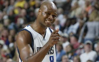 DALLAS - JANUARY 3:  Antoine Walker #8 of the Dallas Mavericks points at the camera during the game against the Minnesota Timberwolves at American Airlines Arena on January 3, 2004 in Dallas, Texas.  The Mavericks won 119-112.  NOTE TO USER: User expressly acknowledges and agrees that, by downloading and/or using this Photograph, User is consenting to the terms and conditions of the Getty Images License Agreement.  (Photo by Glenn James/NBAE via Getty Images)
