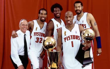 AUBURN HILLS, MI - JUNE 15:  (L-R) Head Coach Larry Brown, Richard Hamilton #32, Ben Wallace #3,  Chauncey Billups #1 and Rasheed Wallace #30 of the Detroit Pistons pose with the championship trophy after Game Five of the 2004 NBA Finals on June 15, 2004 at The Palace of Auburn Hills in Auburn Hills, Michigan. NOTE TO USER: User expressly acknowledges and agrees that, by downloading and/or using this Photograph, User is consenting to the terms and conditions of the Getty Images License Agreement.  Mandatory Copyright Notice: Copyright 2004 NBAE.  (Photo by Andrew D. Bernstein/NBAE via Getty Images)