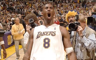 LOS ANGELES - APRIL 30: Kobe Bryant #8 of the Los Angeles Lakers celebrates after making the last second game winning shot in overtime against the Phoenix Suns in game four of the Western Conference Quarterfinals during the 2006 NBA Playoffs at Staples Center on April 30, 2006 in Los Angeles, California. NOTE TO USER: User expressly acknowledges and agrees that, by downloading and or using this photograph, User is consenting to the terms and conditions of the Getty Images License Agreement. Mandatory Copyright Notice: Copyright 2006 NBAE (Photo by Noah Graham/NBAE via Getty Images)