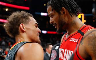 1204234981 ATLANTA, GA - FEBRUARY 29: Trae Young #11 of the Atlanta Hawks and Trevor Ariza #8 of the Portland Trail Blazers hug it out at the conclusion of an NBA game at State Farm Arena on February 29, 2020 in Atlanta, Georgia. NOTE TO USER: User expressly acknowledges and agrees that, by downloading and/or using this photograph, user is consenting to the terms and conditions of the Getty Images License Agreement. (Photo by Todd Kirkland/Getty Images) *** Local Caption *** Trae Young; Trevor Ariza