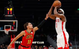 ATLANTA, GEORGIA - JANUARY 08:  James Harden #13 of the Houston Rockets shoots a three-point basket against Trae Young #11 of the Atlanta Hawks in the first half at State Farm Arena on January 08, 2020 in Atlanta, Georgia.  NOTE TO USER: User expressly acknowledges and agrees that, by downloading and/or using this photograph, user is consenting to the terms and conditions of the Getty Images License Agreement.  (Photo by Kevin C. Cox/Getty Images)