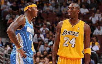 ANAHEIM, CA - OCTOBER 22:  Carmelo Anthony #15 of the Denver Nuggets talks to Kobe Bryant #24 of the Los Angeles Lakers during the preseason game on October 22, 2009 at Honda Center in Anaheim, California.  The Lakers won 106-89.  NOTE TO USER: User expressly acknowledges and agrees that, by downloading and/or using this Photograph, user is consenting to the terms and conditions of the Getty Images License Agreement. Mandatory Copyright Notice: Copyright 2009 NBAE (Photo by Andrew D. Bernstein/NBAE via Getty Images)