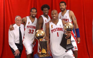 AUBURN HILLS, MI - JUNE 15: (L-R)  Larry Brown, Richard Hamilton #32, Ben Wallace #3, Chauncey Billups #1 (holding his Finals MVP Trophy) and Rasheed Wallace #30 of the Detroit Pistons pose for a portrait with the NBA Championship Trophy after winning the 2004 NBA Championship against the Los Angeles Lakers on June 15, 2004 at the Palace of Auburn Hills in Auburn Hills, Michigan.  NOTE TO USER: User expressly acknowledges and agrees that, by downloading and/or using this Photograph, User is consenting to the terms and conditions of the Getty Images License Agreement.  (Photo by Andrew D. Bernstein/NBAE via Getty Images) 