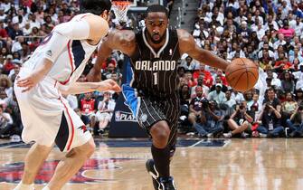 ATLANTA - APRIL 24: Gilbert Arenas #1 of the Orlando Magic drives against Kirk Hinrich #6 of the Atlanta Hawks in Game Four of the Eastern Conference Quarterfinals in the 2011 NBA Playoffs on April 24, 2011 at Philips Arena in Atlanta, Georgia.  NOTE TO USER: User expressly acknowledges and agrees that, by downloading and/or using this Photograph, user is consenting to the terms and conditions of the Getty Images License Agreement. Mandatory Copyright Notice: Copyright 2011 NBAE (Photo by Scott Cunningham/NBAE via Getty Images)