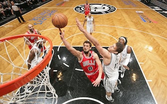 NEW YORK, NY - MAY 4: Marco Belinelli #8 of the Chicago Bulls shoots against Brook Lopez #11 of the Brooklyn Nets during the Game Seven of the Eastern Conference Quarterfinals during the 2013 NBA Playoffs at the Barclays Center on May 4, 2013 in the Brooklyn borough of New York City.  NOTE TO USER: User expressly acknowledges and agrees that, by downloading and/or using this Photograph, user is consenting to the terms and conditions of the Getty Images License Agreement. Mandatory Copyright Notice: Copyright 2013 NBAE (Photo by Nathaniel S. Butler/NBAE via Getty Images)