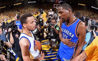 OAKLAND, CA - MAY 30:  Stephen Curry #30 of the Golden State Warriors talks to Kevin Durant #35 of the Oklahoma City Thunder after Game Seven of the Western Conference Finals during the 2016 NBA Playoffs on May 30, 2016 at ORACLE Arena in Oakland, California. NOTE TO USER: User expressly acknowledges and agrees that, by downloading and or using this Photograph, user is consenting to the terms and conditions of the Getty Images License Agreement. Mandatory Copyright Notice: Copyright 2016 NBAE (Photo by Andrew Bernstein/NBAE via Getty Images)