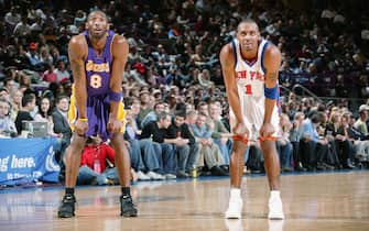 NEW YORK - FEBRUARY 28:  Kobe Bryant #8 of the Los Angeles Lakers stands on the court with Anfernee Hardaway #1 of the New York Knicks during the game of the New York Knicks on February 28, 2005 at Madison Square Garden in New York, New York. The Knicks won 117-115 in overtime.  NOTE TO USER: User expressly acknowledges and agrees that, by downloading and/or using this Photograph, user is consenting to the terms and conditions of the Getty Images License Agreement. Mandatory Copyright Notice: Copyright 2005 NBAE  (Photo by Nathaniel S. Butler/NBAE via Getty Images) *** Local Caption *** Kobe Bryant;Anfernee Hardaway