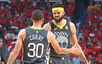 NEW ORLEANS, LA - MAY 4:  Stephen Curry #30 and JaVale McGee #1 of the Golden State Warriors exchange a high five during Game Three of the Western Conference Semi Finals of the 2018 NBA Playoffs against the New Orleans Pelicans  on May 4, 2018 at the Smoothie King Center in New Orleans, Louisiana. NOTE TO USER: User expressly acknowledges and agrees that, by downloading and or using this Photograph, user is consenting to the terms and conditions of the Getty Images License Agreement. Mandatory Copyright Notice: Copyright 2018 NBAE (Photo by Layne Murdoch/NBAE via Getty Images)