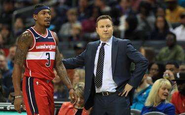 CHARLOTTE, NORTH CAROLINA - DECEMBER 10: Bradley Beal #3 of the Washington Wizards walks off the court alongside head coach Scott Brooks during their game against the Charlotte Hornets at Spectrum Center on December 10, 2019 in Charlotte, North Carolina. NOTE TO USER: User expressly acknowledges and agrees that, by downloading and or using this photograph, User is consenting to the terms and conditions of the Getty Images License Agreement. (Photo by Streeter Lecka/Getty Images)