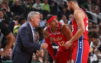 MILWAUKEE, WI - FEBRUARY 6: Head Coach, Brett Brown, Tobias Harris #12 and Ben Simmons #25 of the Philadelphia 76ers share a conversation during the game against the Milwaukee Bucks on February 6, 2020 at the Fiserv Forum Center in Milwaukee, Wisconsin. NOTE TO USER: User expressly acknowledges and agrees that, by downloading and or using this Photograph, user is consenting to the terms and conditions of the Getty Images License Agreement. Mandatory Copyright Notice: Copyright 2020 NBAE (Photo by Gary Dineen/NBAE via Getty Images).