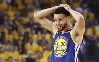OAKLAND, CALIFORNIA - APRIL 24:  Stephen Curry #30 of the Golden State Warriors reacts after being called for a foul against the LA Clippers during Game Five of the first round of the 2019 NBA Western Conference Playoffs at ORACLE Arena on April 24, 2019 in Oakland, California. NOTE TO USER: User expressly acknowledges and agrees that, by downloading and or using this photograph, User is consenting to the terms and conditions of the Getty Images License Agreement. (Photo by Ezra Shaw/Getty Images)
