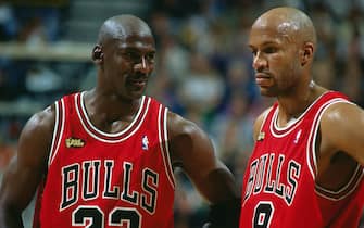 SALT LAKE CITY - JUNE 14:  Michael Jordan #23 and Ron Harper #9 of the Chicago Bulls look on during game six of the 1998 NBA Finals against the Utah Jazz on June 14, 1998 in Salt Lake City, Utah.  NOTE TO USER: User expressly acknowledges and agrees that, by downloading and/or using this photograph, user is consenting to the terms and conditions of the Getty Images License Agreement.  Mandatory Copyright Notice: Copyright 1998 NBAE  (Photo by Nathaniel S. Butler/NBAE via Getty Images)