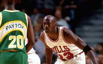 56249414 CHICAGO - 1996: Michael Jordan #23 of the Chicago Bulls plays defense against Gary Payton of the Seattles Sonics during an NBA game at the United Center circa 1996 in Chicago, Illinois. NOTE TO USER: User expressly acknowledges and agrees that, by downloading and or using this Photograph, user is consenting to the terms and conditions of the Getty Images License Agreement. Mandatory Copyright Notice: Copyright 1996 NBAE (Photo by Scott Cunningham/NBAE via Getty Images)