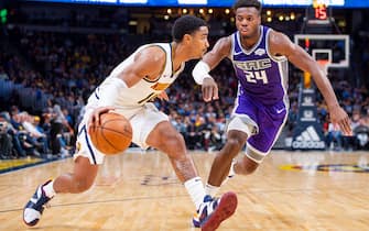 DENVER, CO - OCTOBER 23: Gary Harris #14 of the Denver Nuggets drives to the basket past Buddy Hield #24 of the Sacramento Kings during the second half at Pepsi Center on October 23, 2018 in Denver, Colorado. NOTE TO USER: User expressly acknowledges and agrees that, by downloading and or using this photograph, User is consenting to the terms and conditions of the Getty Images License Agreement. (Photo by Timothy Nwachukwu/Getty Images)