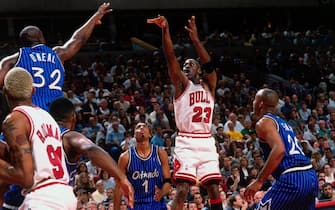 CHICAGO - MAY 19:  Michael Jordan #23 of the Chicago Bulls shoots a jump shot against Shaquille O'Neal #32 of the Orlando Magic in Game One of the Eastern Conference Finals during the 1996 NBA Playoffs at the United Center on May 19, 1996 in Chicago. The Chicago Bulls defeated the Orlando Magic 121-83. NOTE TO USER: User expressly acknowledges and agrees that, by downloading and or using this photograph, User is consenting to the terms and conditions of the Getty Images License Agreement. Mandatory Copyright Notice: Copyright 1996 NBAE (Photo by Andrew D. Bernstein/NBAE via Getty Images)