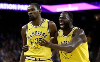 OAKLAND, CALIFORNIA - APRIL 02:  Kevin Durant #35 of the Golden State Warriors is escorted off the court by Draymond Green #23 after Durant was ejected from the game for complaining about a call during their game against the Denver Nuggets at ORACLE Arena on April 02, 2019 in Oakland, California.  NOTE TO USER: User expressly acknowledges and agrees that, by downloading and or using this photograph, User is consenting to the terms and conditions of the Getty Images License Agreement. (Photo by Ezra Shaw/Getty Images)