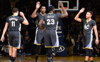 OAKLAND, CA - DECEMBER 17: Draymond Green #23, Stephen Curry #30, Kevin Durant #35 and Klay Thompson #11 of the Golden State Warriors high five each other during the game against the Portland Trail Blazers on December 17, 2016 in Oakland, California. NOTE TO USER: User expressly acknowledges and agrees that, by downloading and/or using this Photograph, user is consenting to the terms and conditions of the Getty Images License Agreement. Mandatory Copyright Notice: Copyright 2016 NBAE (Photo by Andrew D. Bernstein/NBAE via Getty Images)