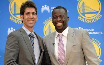 OAKLAND, CA - JULY 9:  General Manager Bob Myers of the Golden State Warriors and Draymond Green pose for a photo during a press conference announcing him re-signing with the team today at the Warriors Training Center on July 9, 2015 in Oakland, California. NOTE TO USER: User expressly acknowledges and agrees that, by downloading and/or using this Photograph, user is consenting to the terms and conditions of the Getty Images License Agreement. Mandatory Copyright Notice: Copyright 2015 NBAE (Photo by Noah Graham/NBAE via Getty Images)