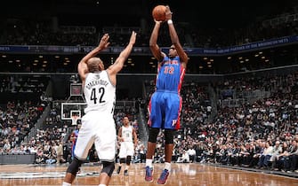 BROOKLYN, NY - APRIL 17: Khris Middleton #32 of the Detroit Pistons shoots against Jerry Stackhouse #42 of the Brooklyn Nets on April 17, 2013 at the Barclays Center in the Brooklyn borough of New York City.  NOTE TO USER: User expressly acknowledges and agrees that, by downloading and or using this photograph, User is consenting to the terms and conditions of the Getty Images License Agreement. Mandatory Copyright Notice: Copyright 2013 NBAE  (Photo by Nathaniel S. Butler/NBAE via Getty Images)