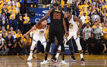 OAKLAND, CA - MAY 31: LeBron James #23 of the Cleveland Cavaliers handles the ball against Stephen Curry #30 and Kevin Durant #35 of the Golden State Warriors in Game One of the 2018 NBA Finals on May 31, 2018 at ORACLE Arena in Oakland, California. NOTE TO USER: User expressly acknowledges and agrees that, by downloading and or using this photograph, user is consenting to the terms and conditions of Getty Images License Agreement. Mandatory Copyright Notice: Copyright 2018 NBAE (Photo by Andrew D. Bernstein/NBAE via Getty Images)